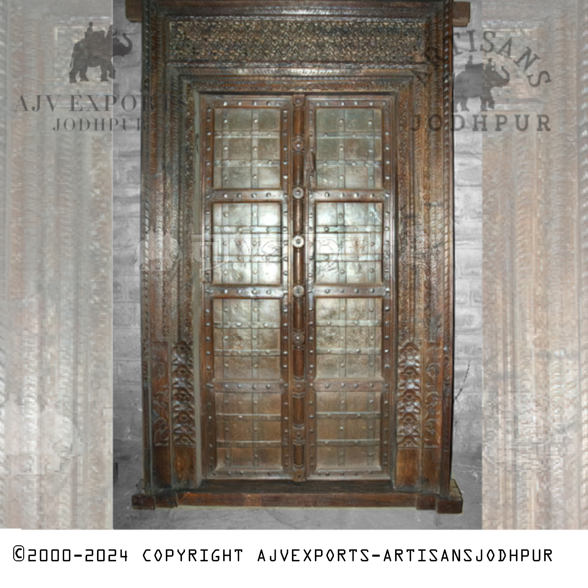 An elegant wooden door featuring glass panels set within a finely carved frame, originating from Jodhpur, India.