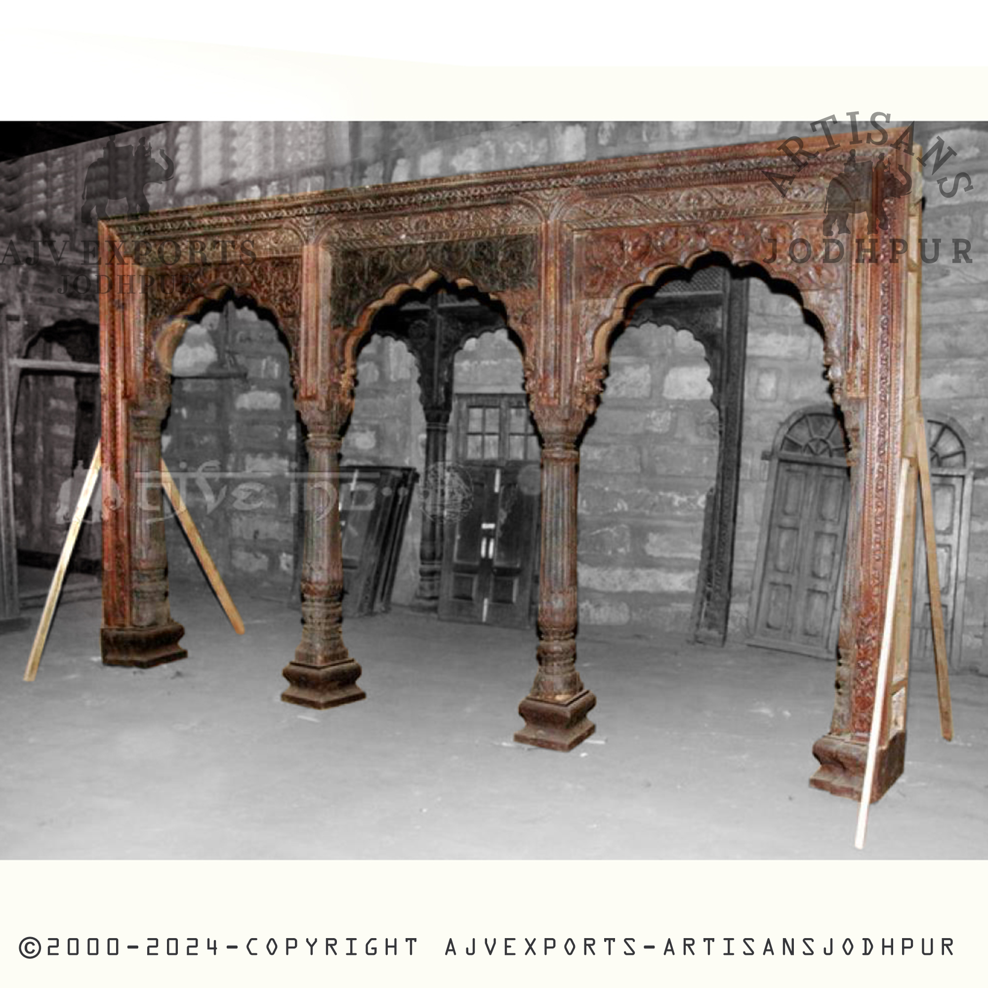 An exquisite carved wooden archway featuring intricate designs and elegant craftsmanship from AJV Exports Jodhpur