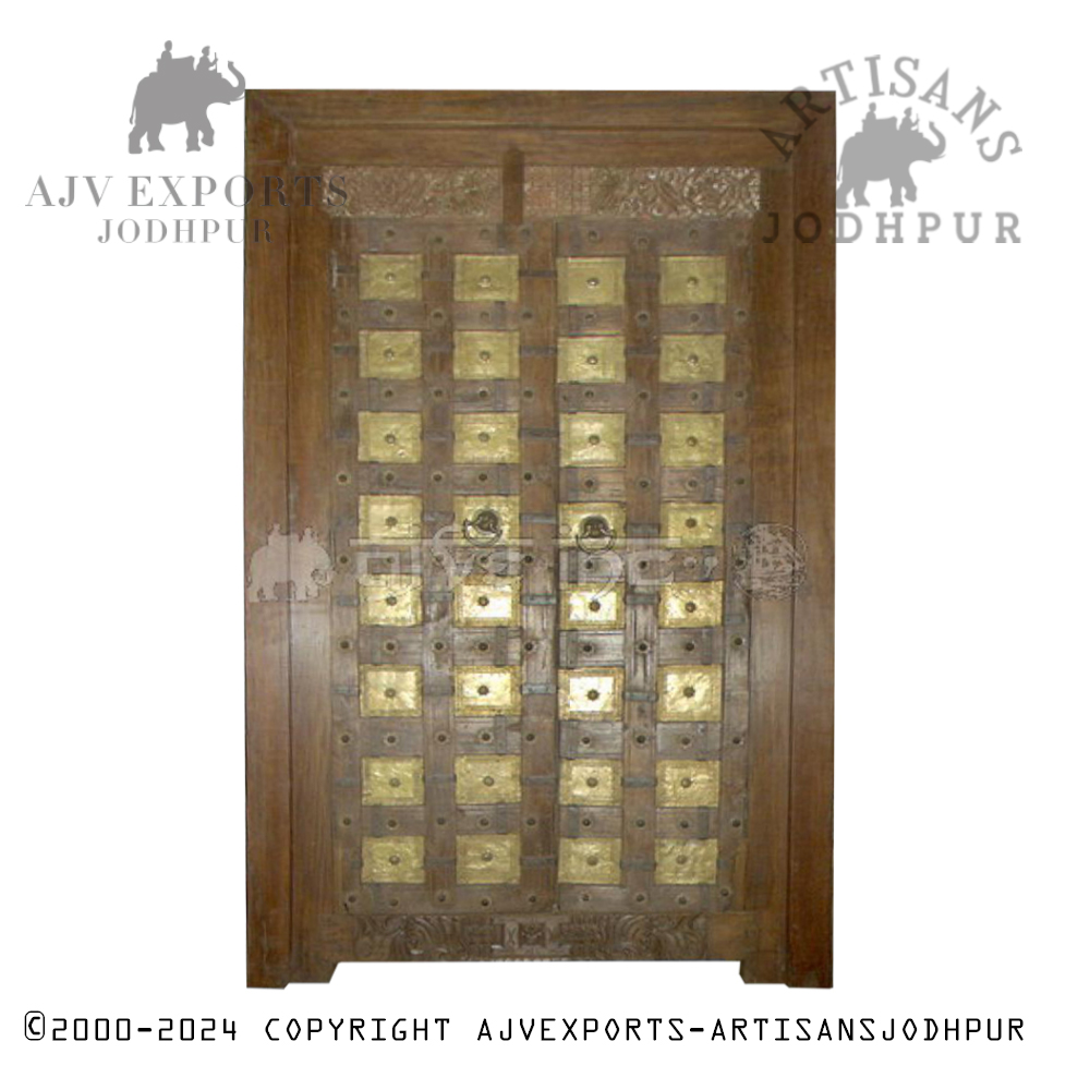 A traditional Indian door with carved panels and detailed design, showcasing the rich cultural heritage of Jodhpur.