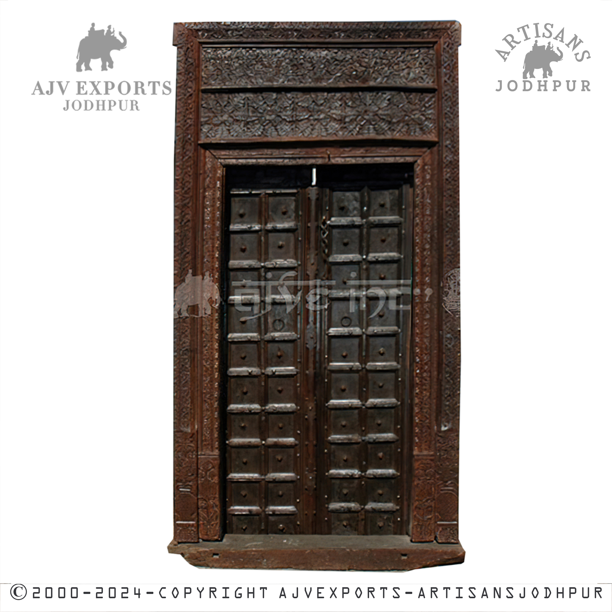 A dark brown traditional door adorned with detailed carvings and iron fittings.