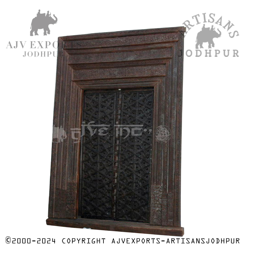 Rustic  wooden door with carved motifs from Artisans Jodhpur.