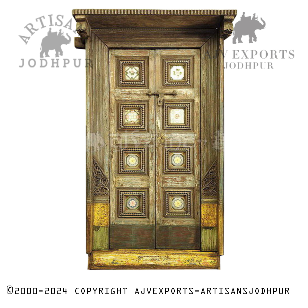 Ornate wooden door with brass decorations and intricate detailing, crafted by Artisans Jodhpur.