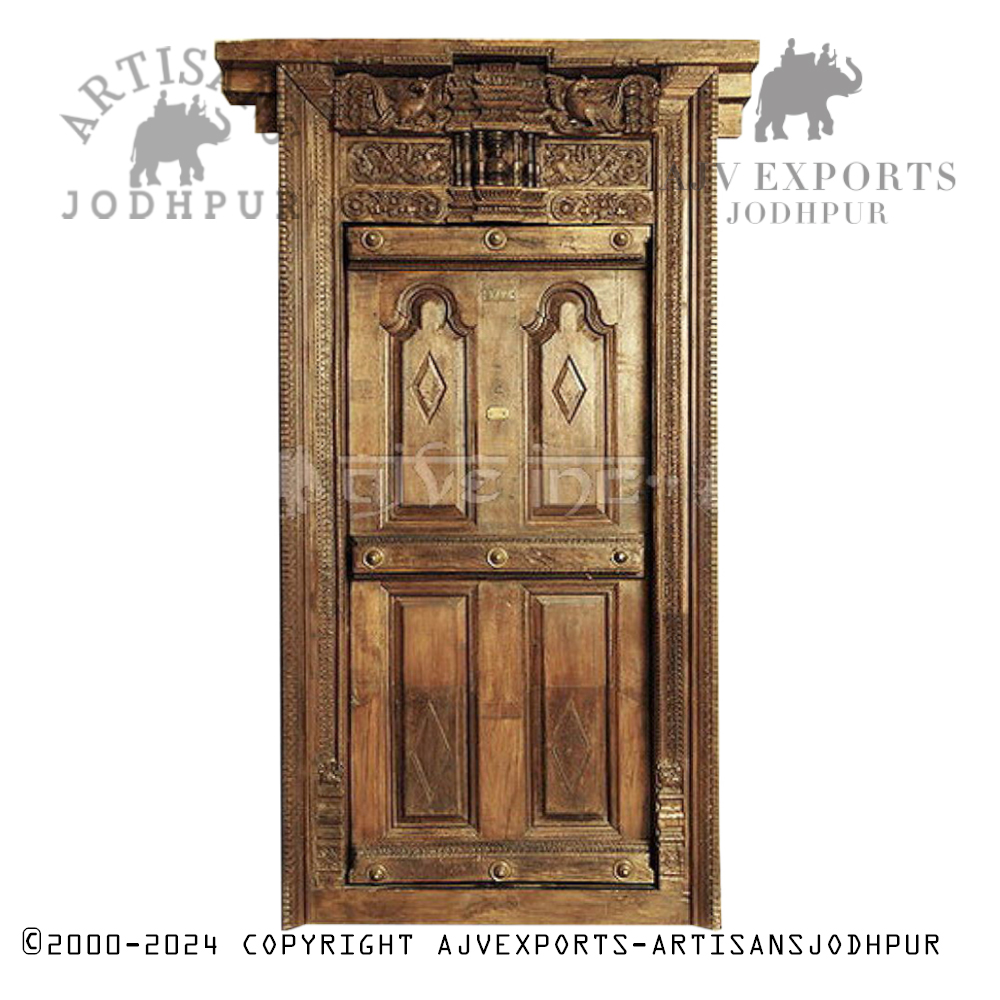Antique wooden door with carved panels and a rich finish, handcrafted by Artisans Jodhpur.