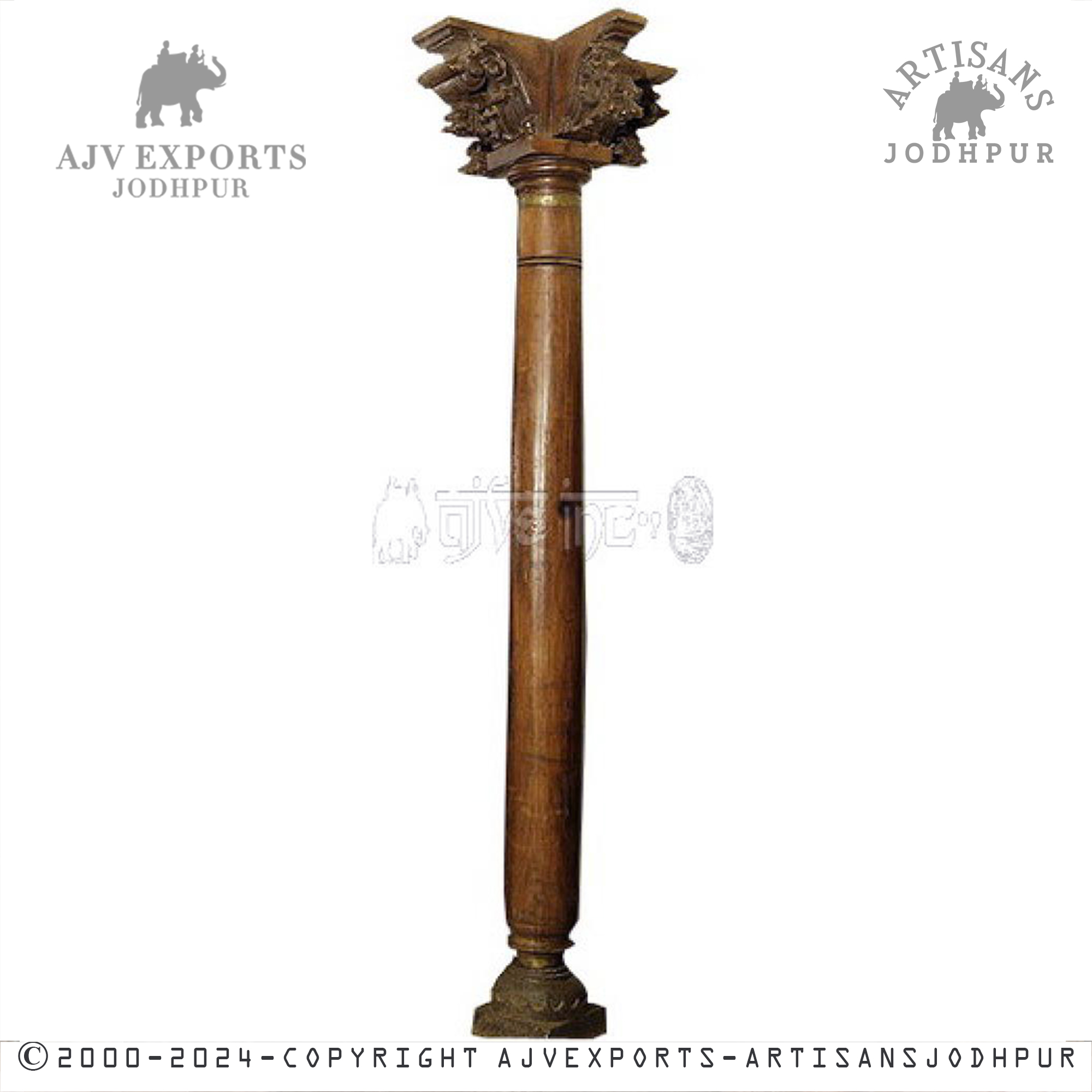 A single tall, brown wooden column with elaborate carvings and a distinctively styled top, placed on a simple base.