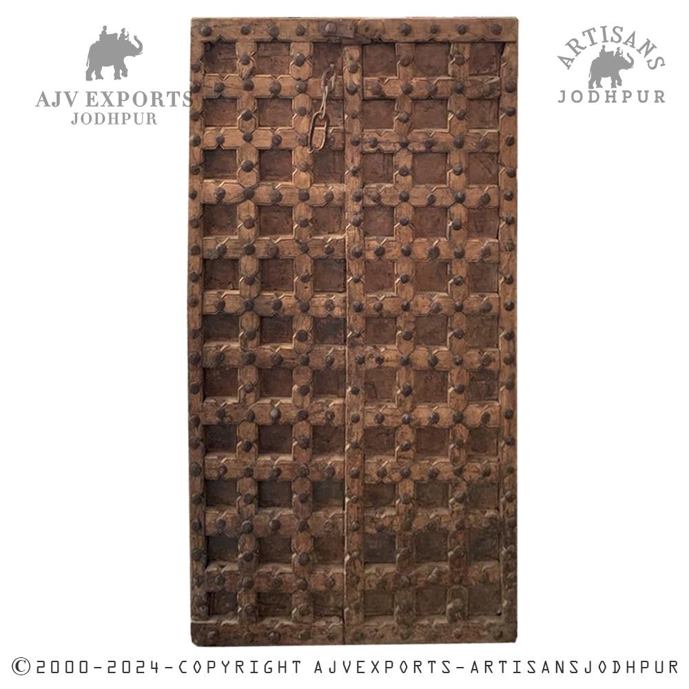 Aged wooden door with metal accents and rich patina