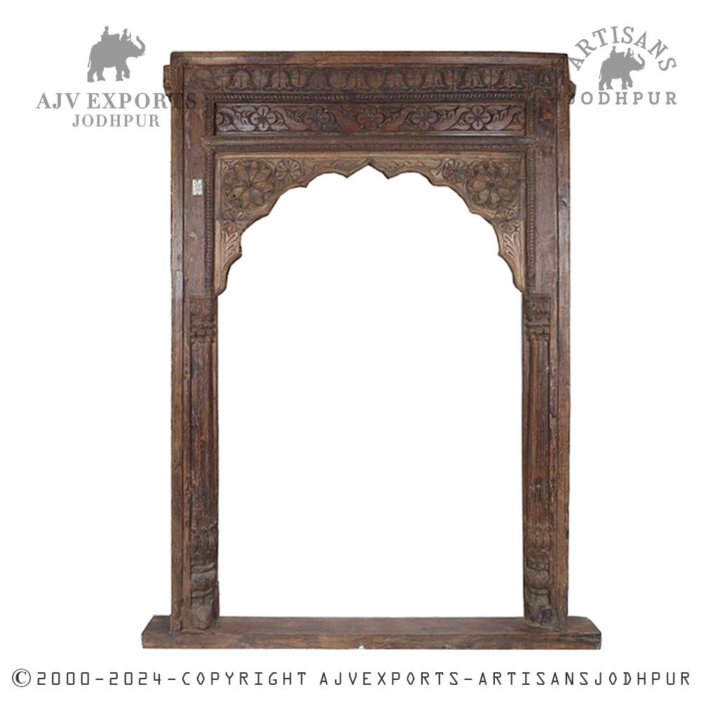 Antique carved wooden archway frame with floral and geometric motifs