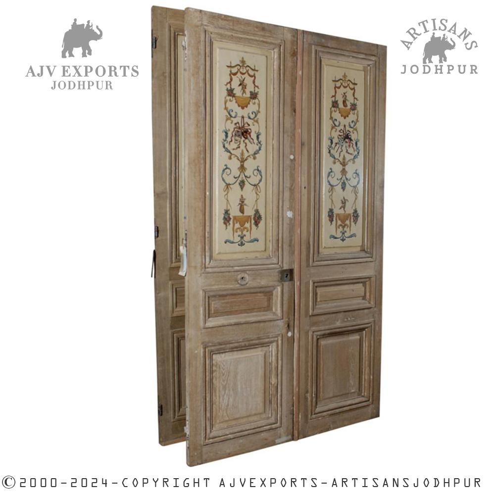 Antique wooden door with detailed floral carvings.