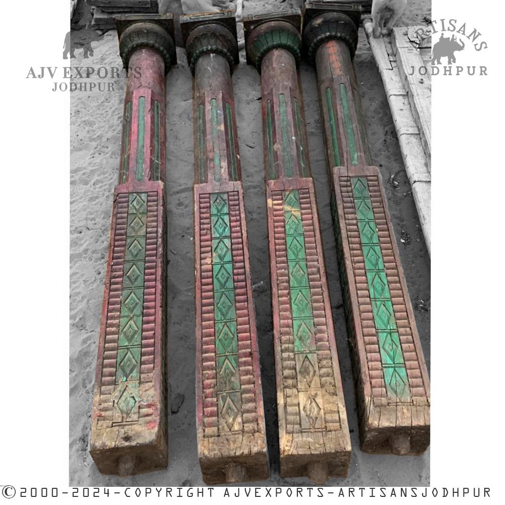 Rustic wooden pillars with painted designs, capturing the essence of traditional Indian style.