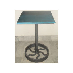 industrial  table with industrial wheel as base.