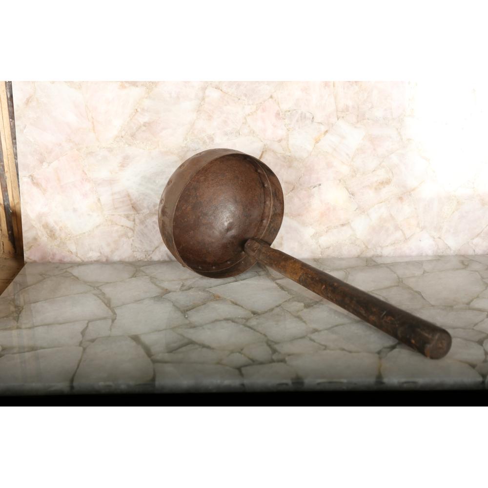 Large rustic iron ladle with authentic antique detailing, perfect for decor.