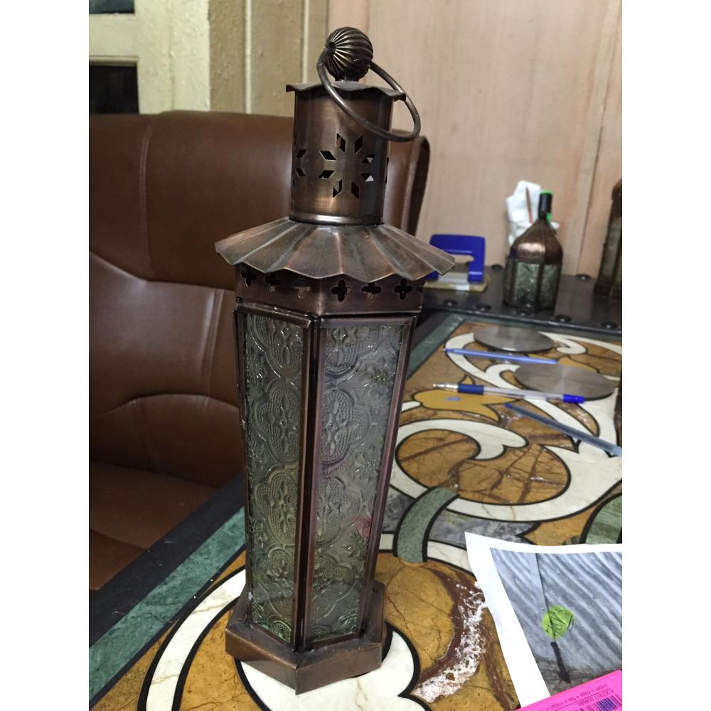 Hexagonal vintage lantern with floral glass patterns and a rustic finish.