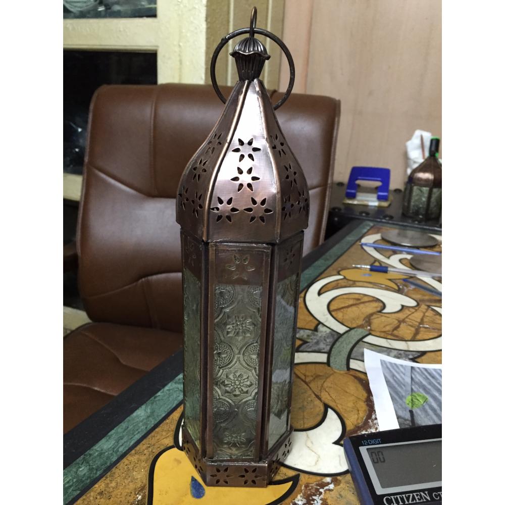 Elegant perforated lantern with etched glass panels for ambient lighting.