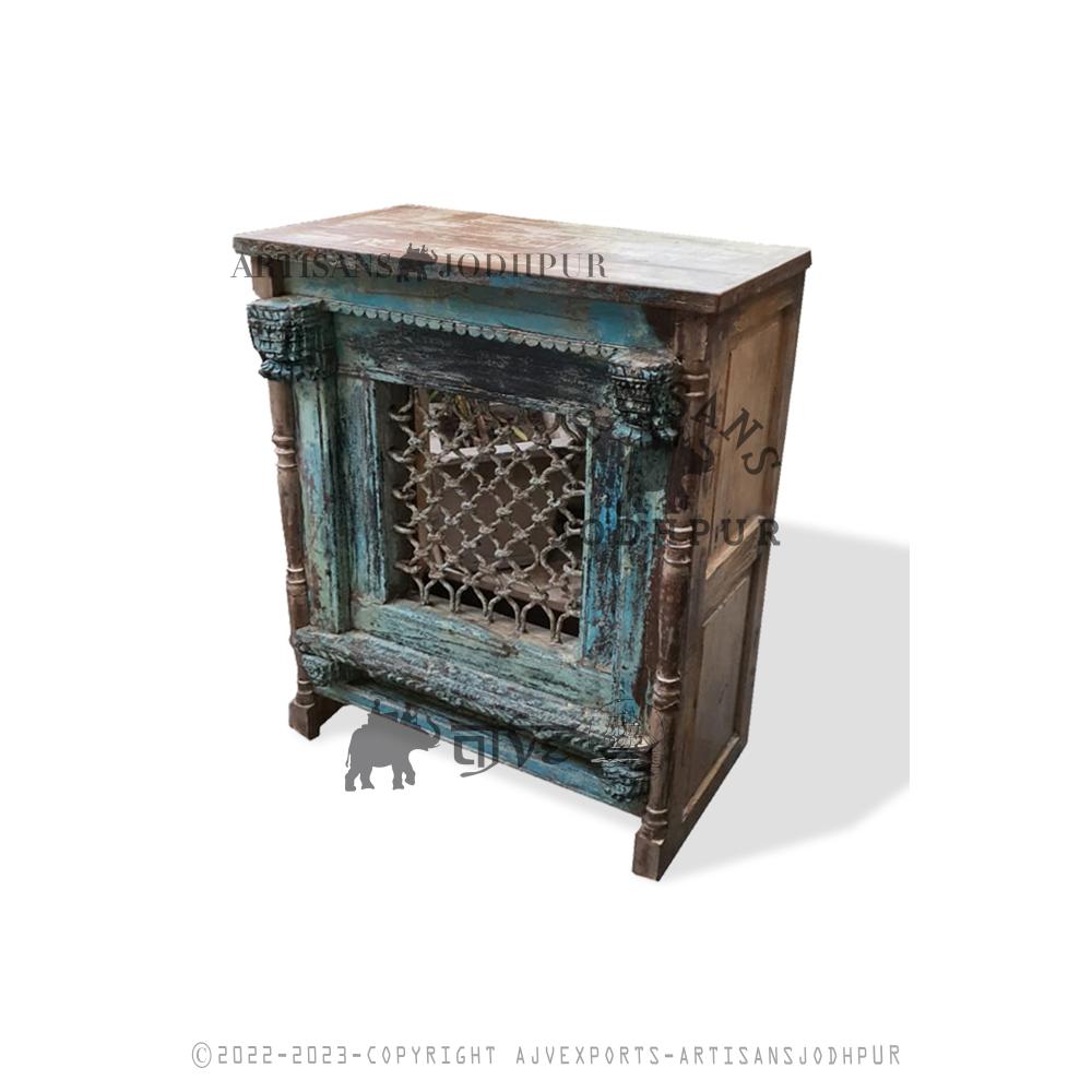Antique-style wooden cabinet with decorative iron mesh and distressed turquoise finish.