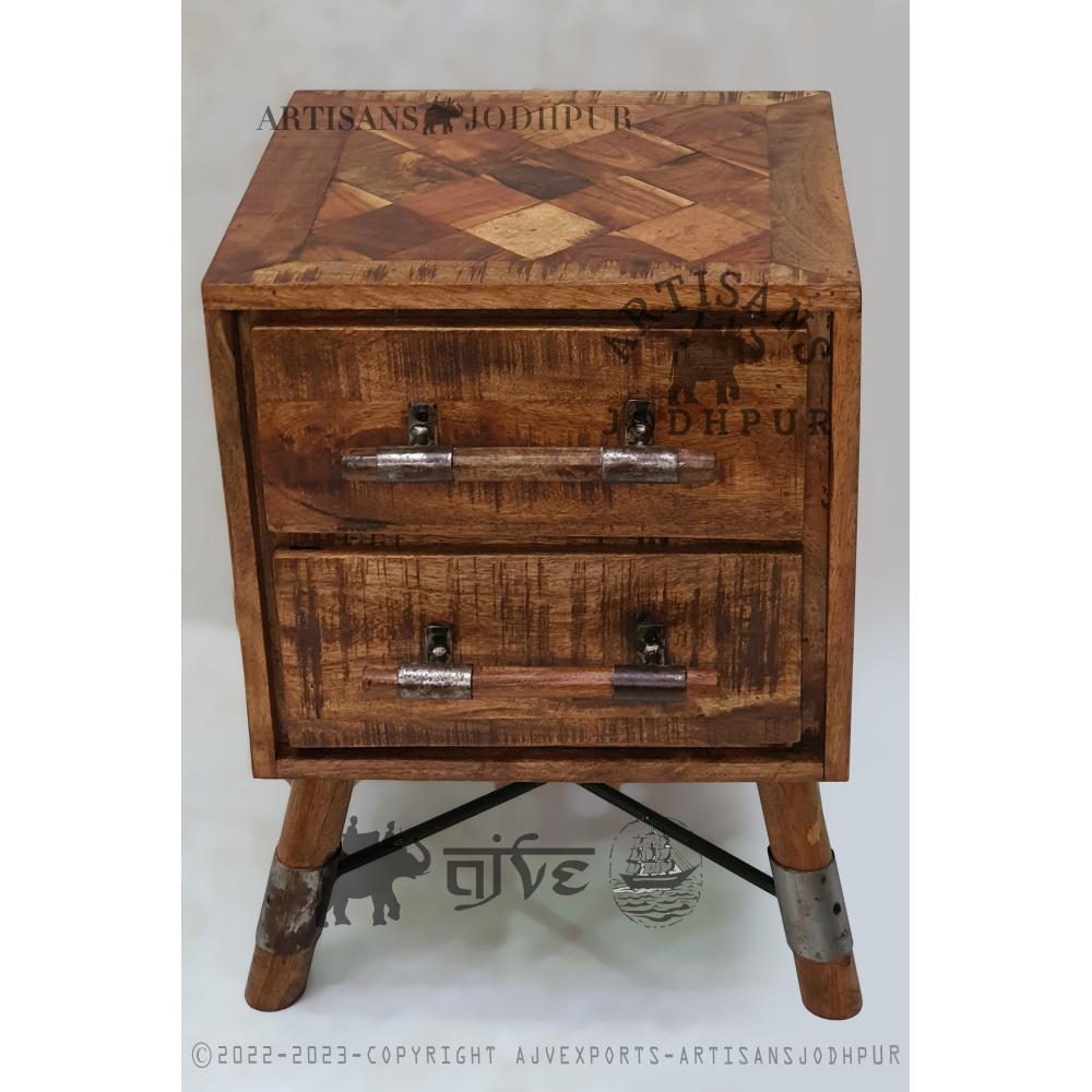 Handcrafted wooden cabinet with chevron pattern and iron handles, blending rustic and modern design.