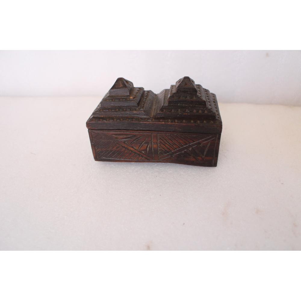 Antique wooden box with detailed carvings and a rich dark tone.