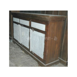 Wooden hand-carved storage cabinet with three white painted doors and drawers