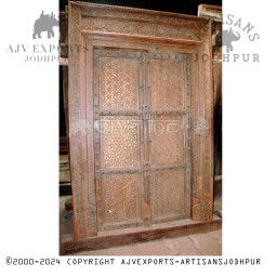 Wooden door with metalwork and carvings