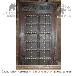 Wooden door with brass and detailed carvings