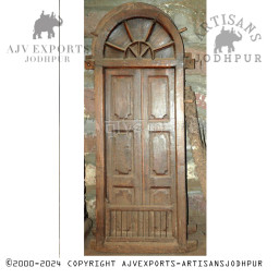 Wooden door with intricate metal accents