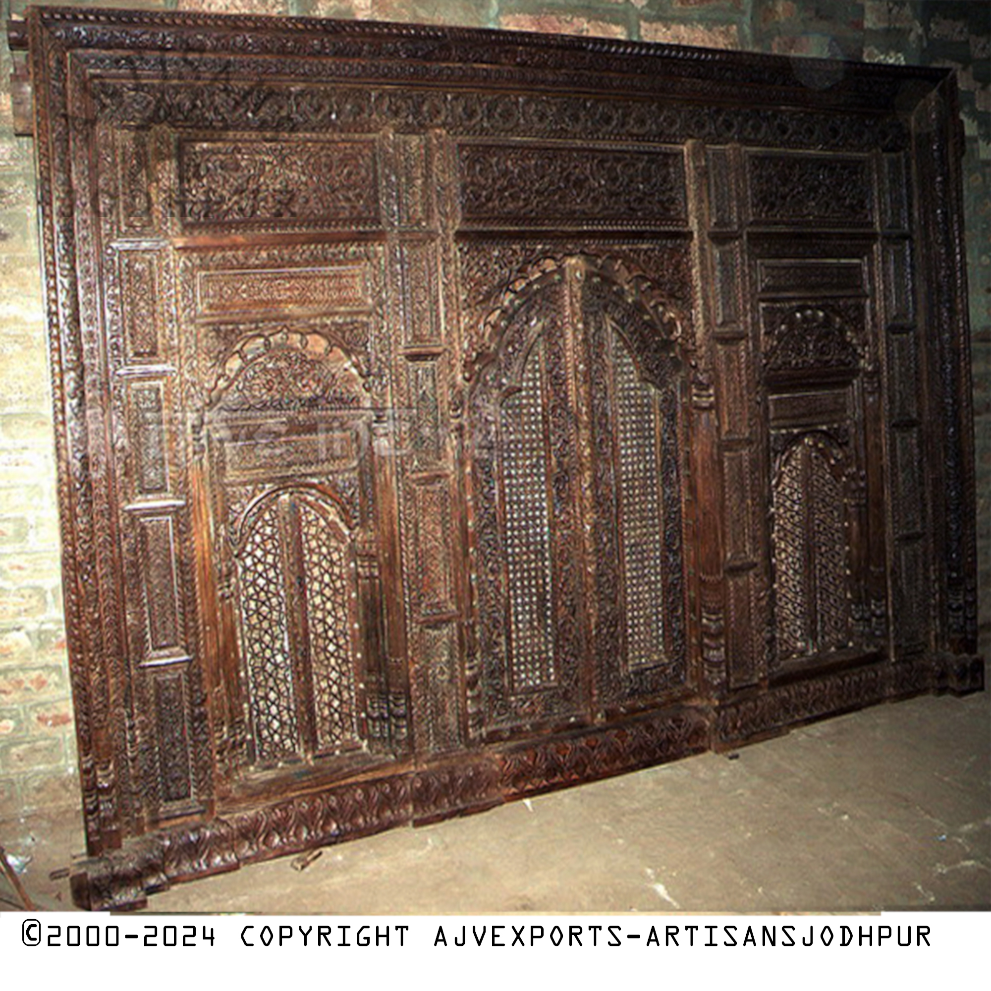 Wooden door with intricate designs and robust build