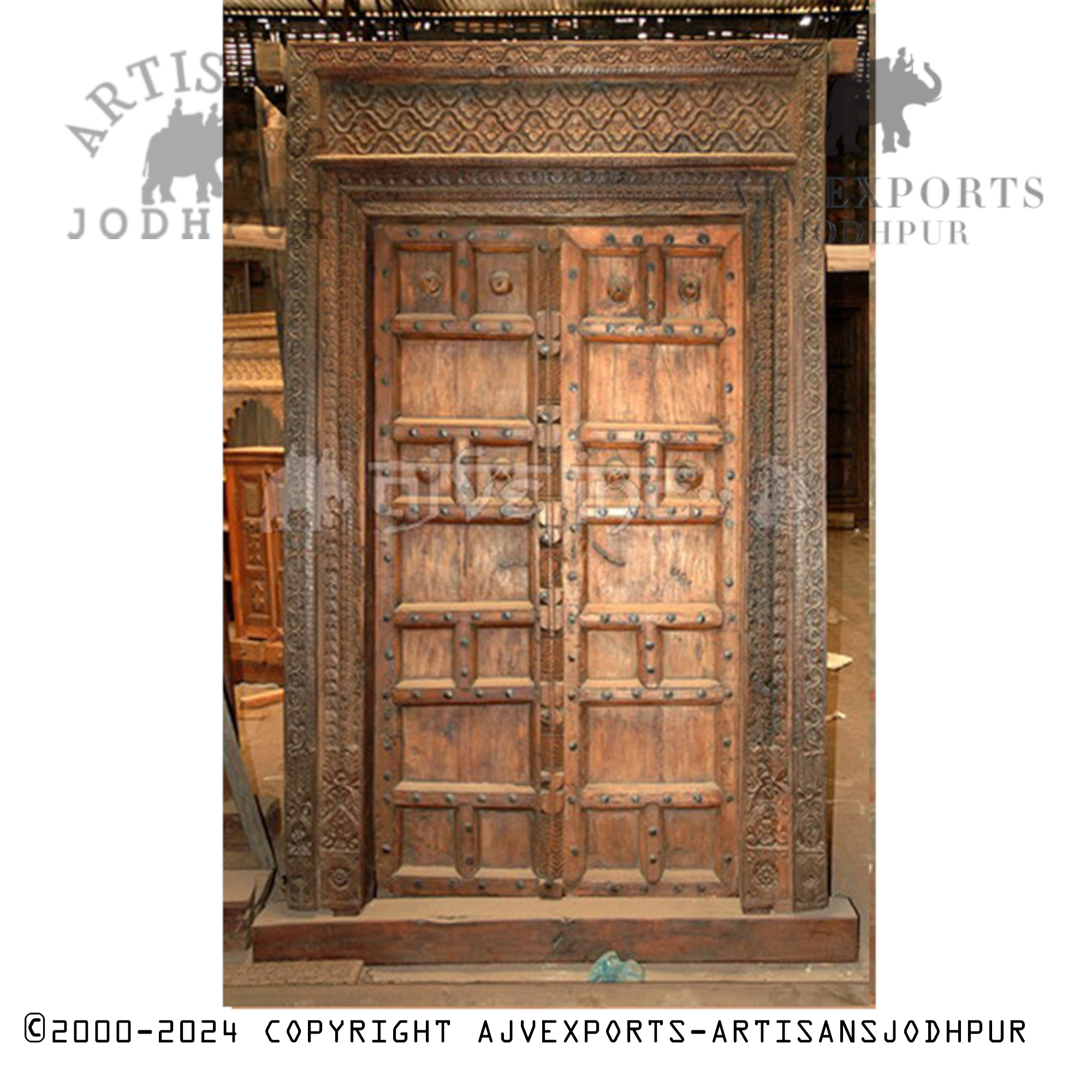 Antique wooden door with geometric carvings
