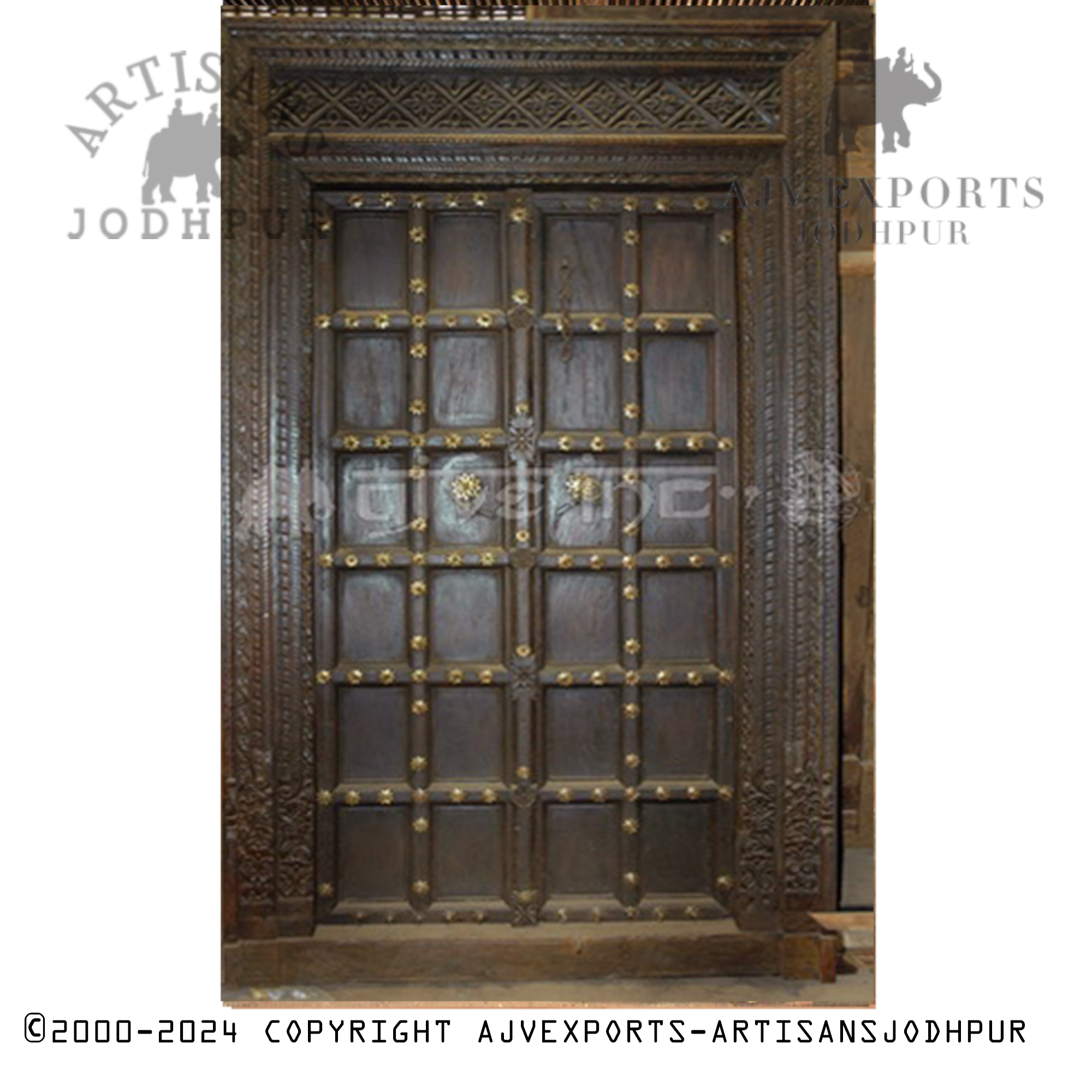 Wooden door with brass accents and intricate designs