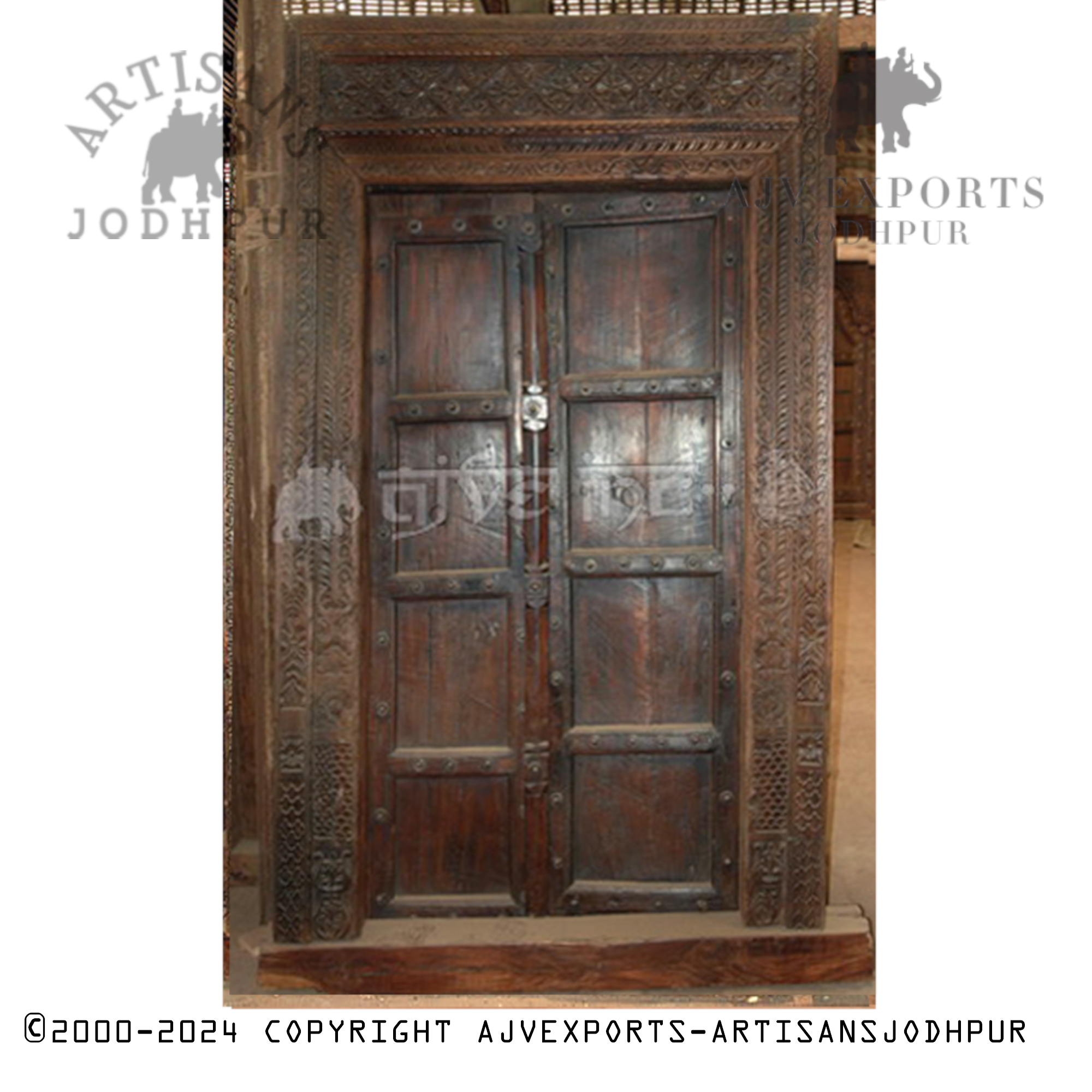 Dark wooden door with traditional carvings