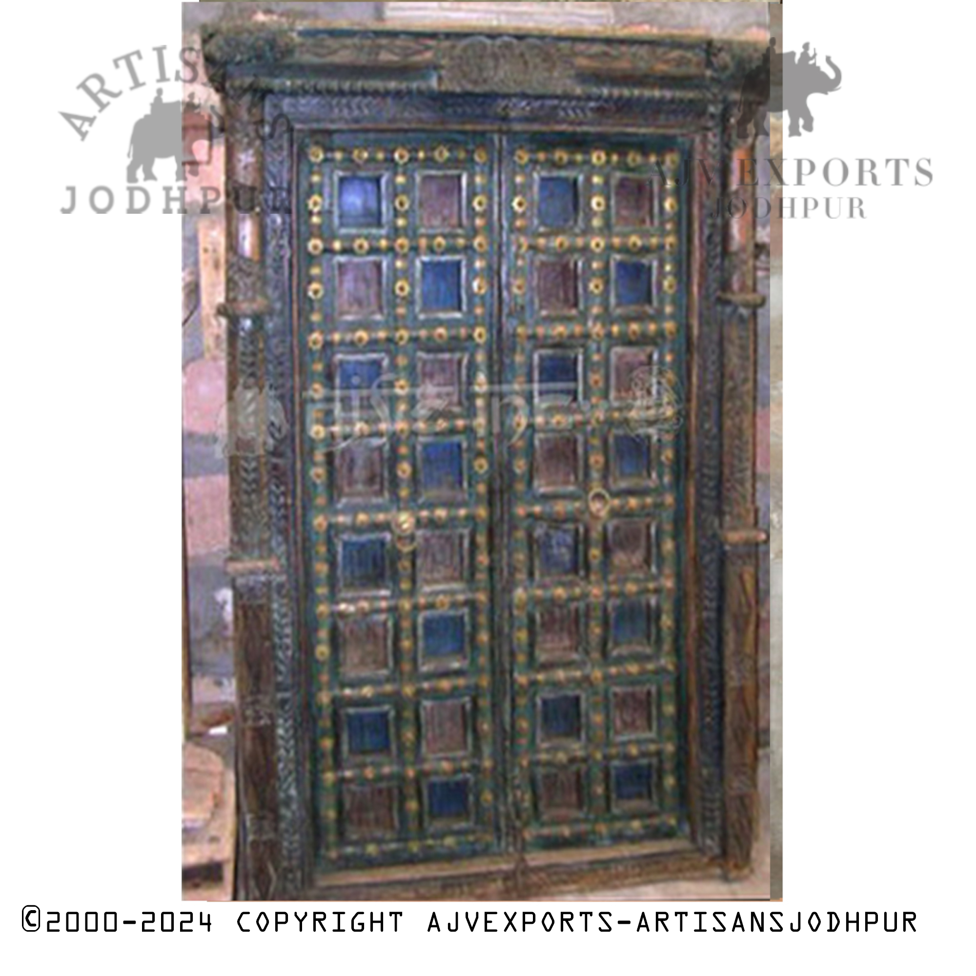 Wooden door with brass accents and colorful panels