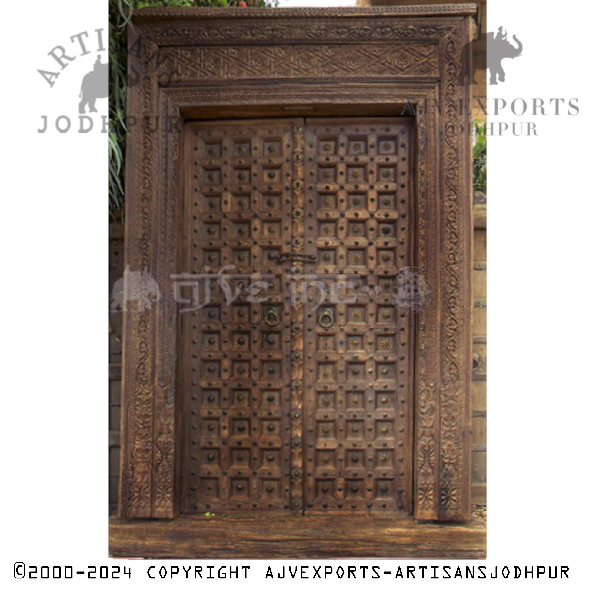 Wooden door with brass accents and detailed designs