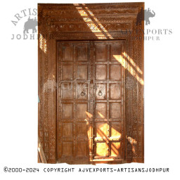 Wooden door with detailed carvings and dark finish