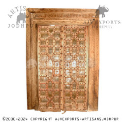 Wooden door with brass accents and geometric carvings