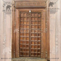 Grand wooden door with elaborate carvings