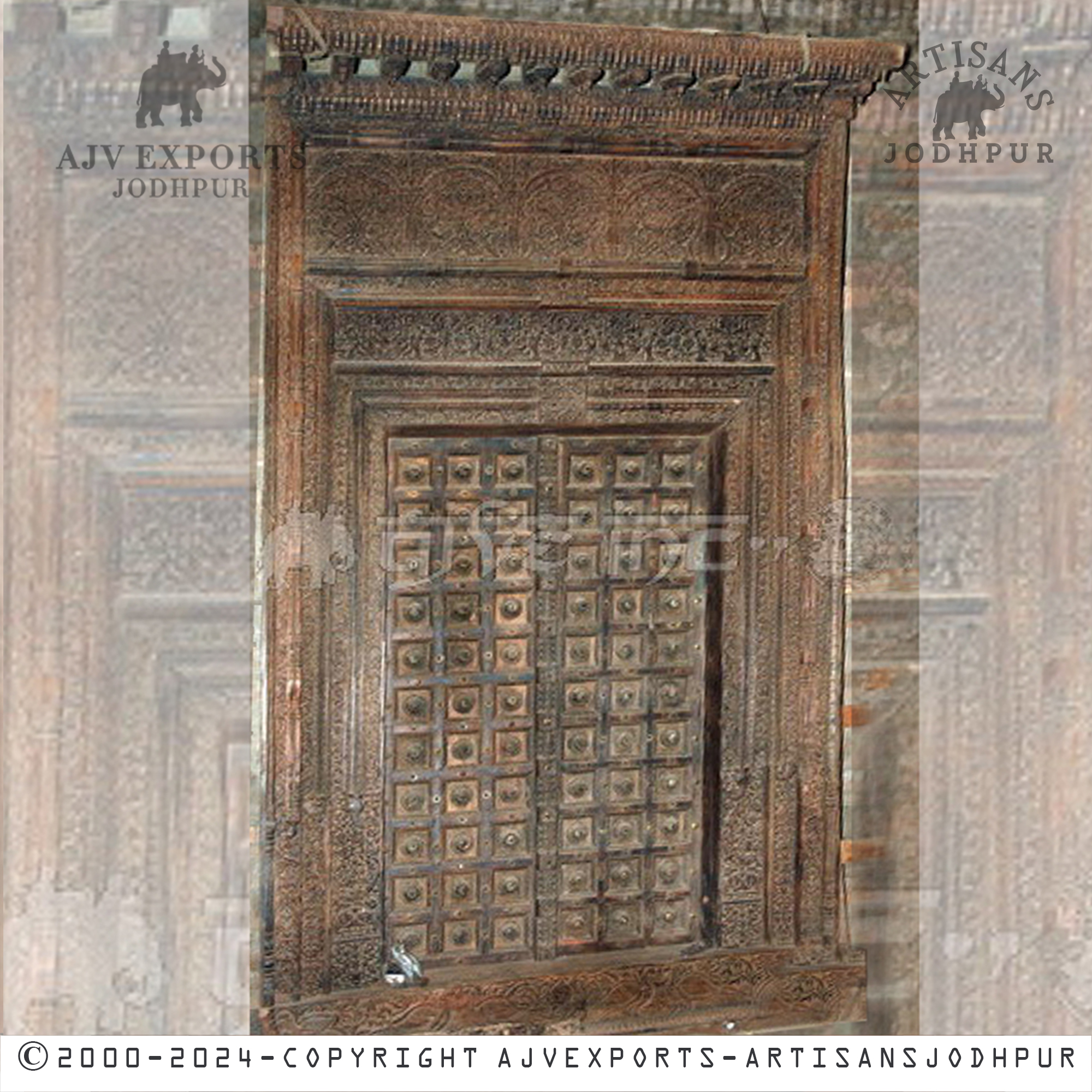 Rustic wooden door with intricate carvings and a weathered finish, ideal for vintage and classic decor styles.