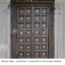 Elegant Wooden Door with Golden Studs