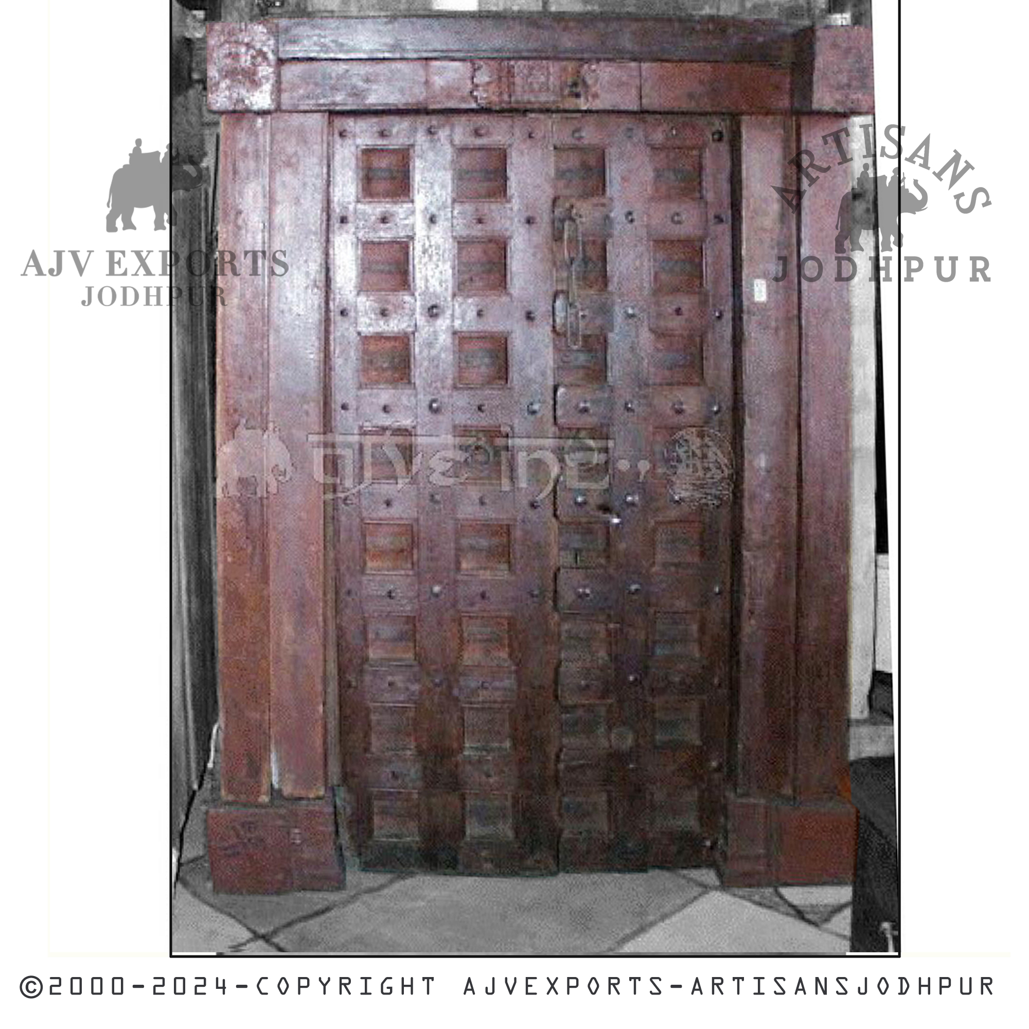 A traditional wooden door featuring a unique grid pattern, exemplifying style and heritage from AJV Exports Jodhpur