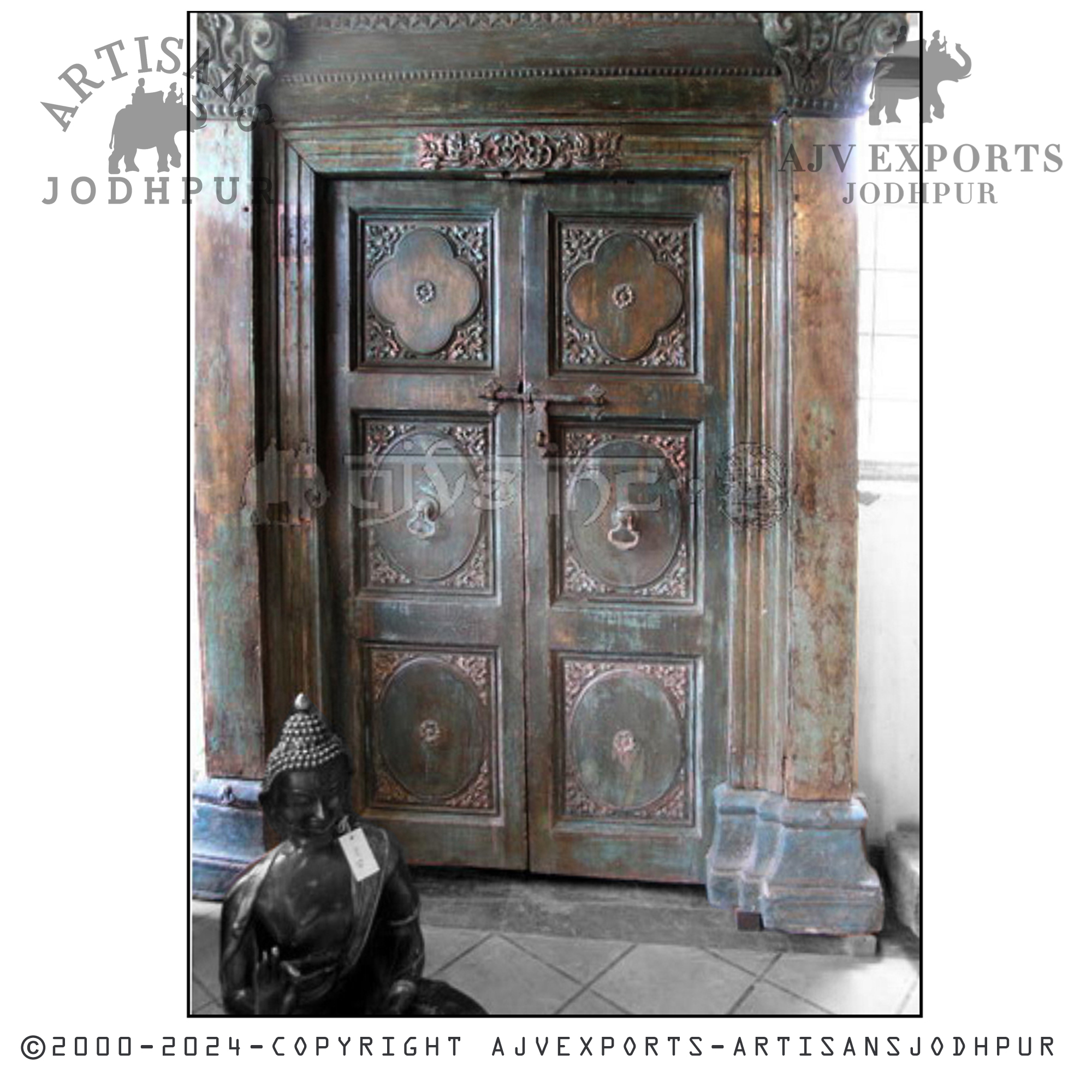 An ornately designed antique door with intricate carvings and a patina finish, highlighting Jodhpur's craftsmanship.
