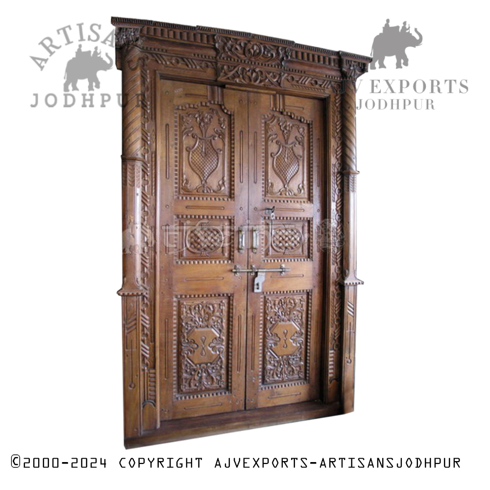 An ornately carved wooden doorway with intricate designs, showcasing the exceptional craftsmanship of Jodhpur artisans.