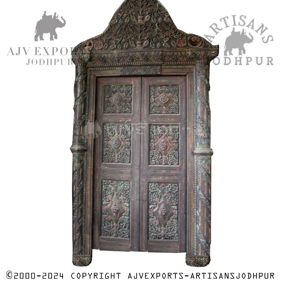 An antique wooden door with ornate carvings, showcasing the rich cultural heritage of Jodhpur.
