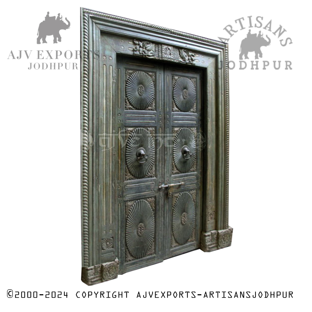 A decorative wooden door with traditional carvings, showcasing the skilled craftsmanship of Jodhpur.