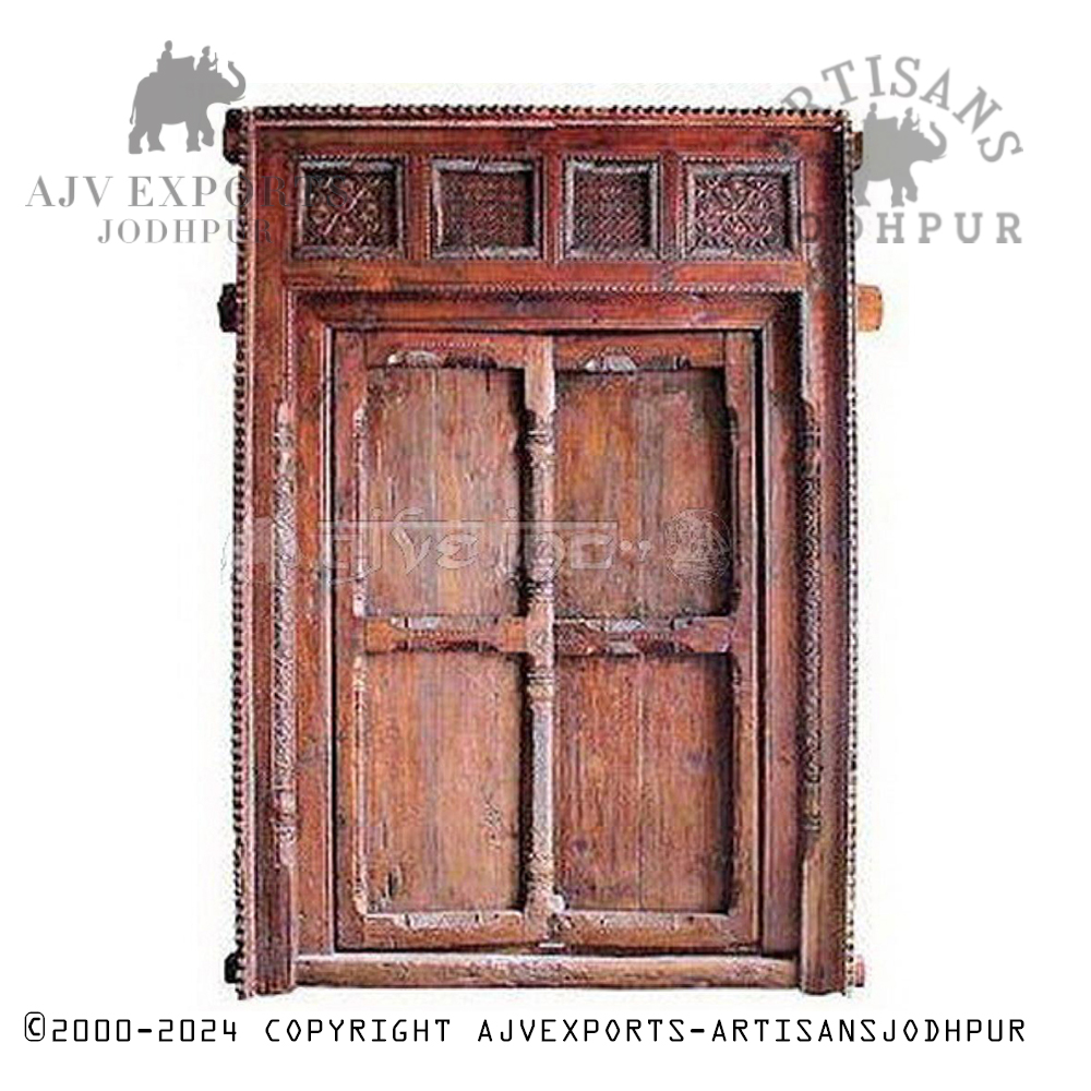 An antique wooden door with intricate floral carvings, highlighting the rich cultural heritage of Jodhpur.