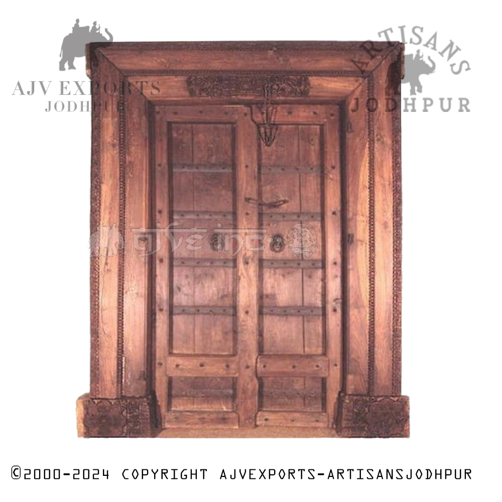 An antique wooden door with traditional Indian design elements and detailed carvings, showcasing Jodhpur's craftsmanship.