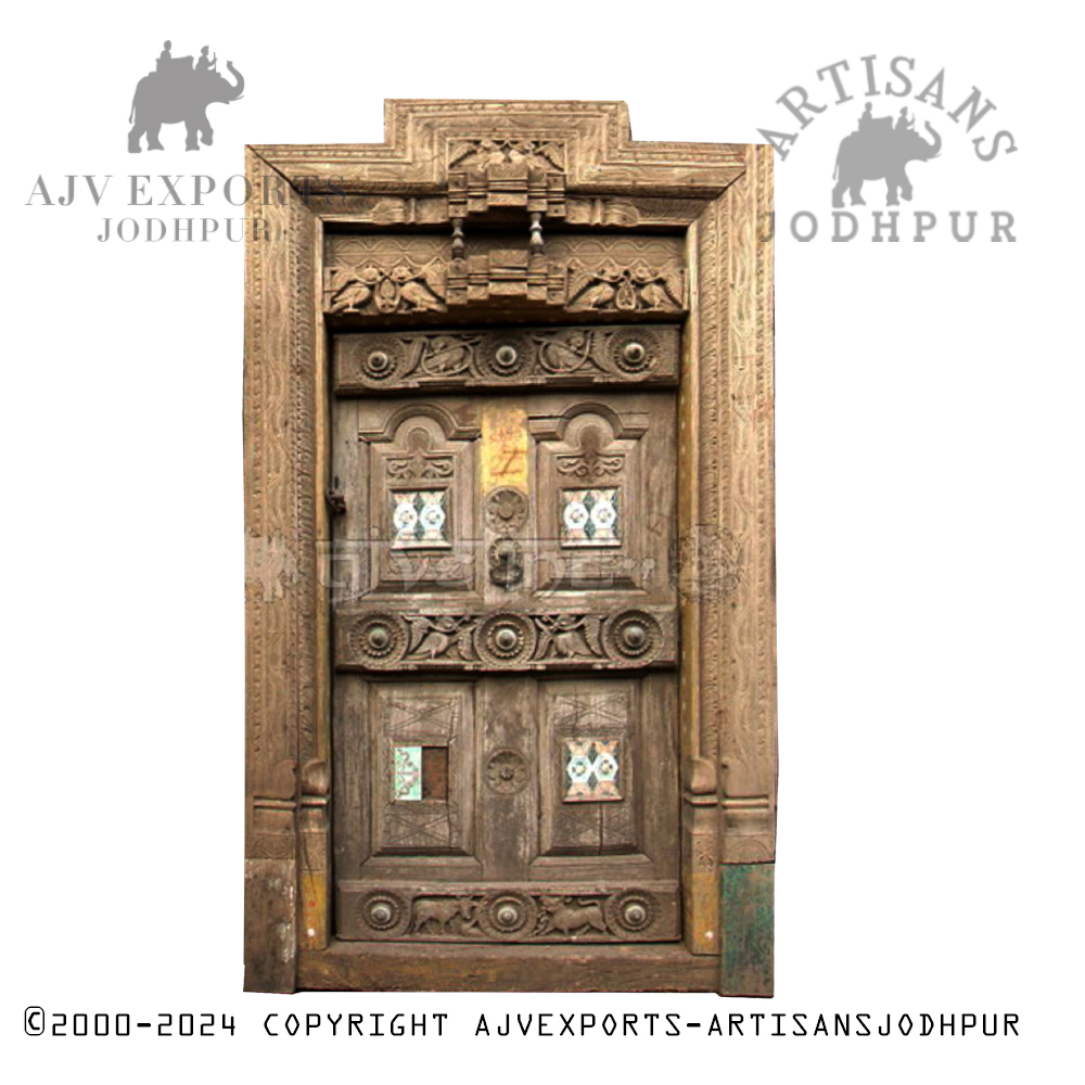 A rustic wooden door with intricate patterns and traditional Indian designs