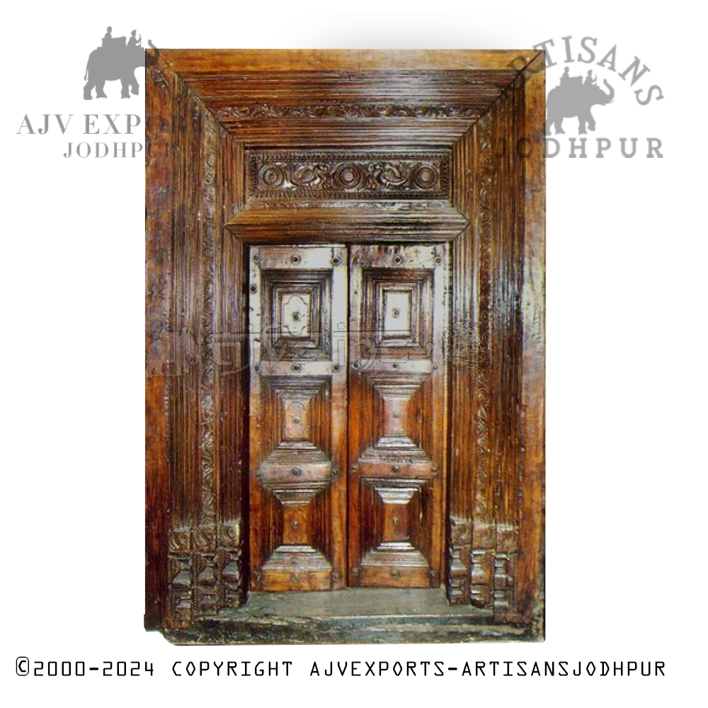 Antique wooden door with ornate carvings, showcasing the rich cultural history of Jodhpur.