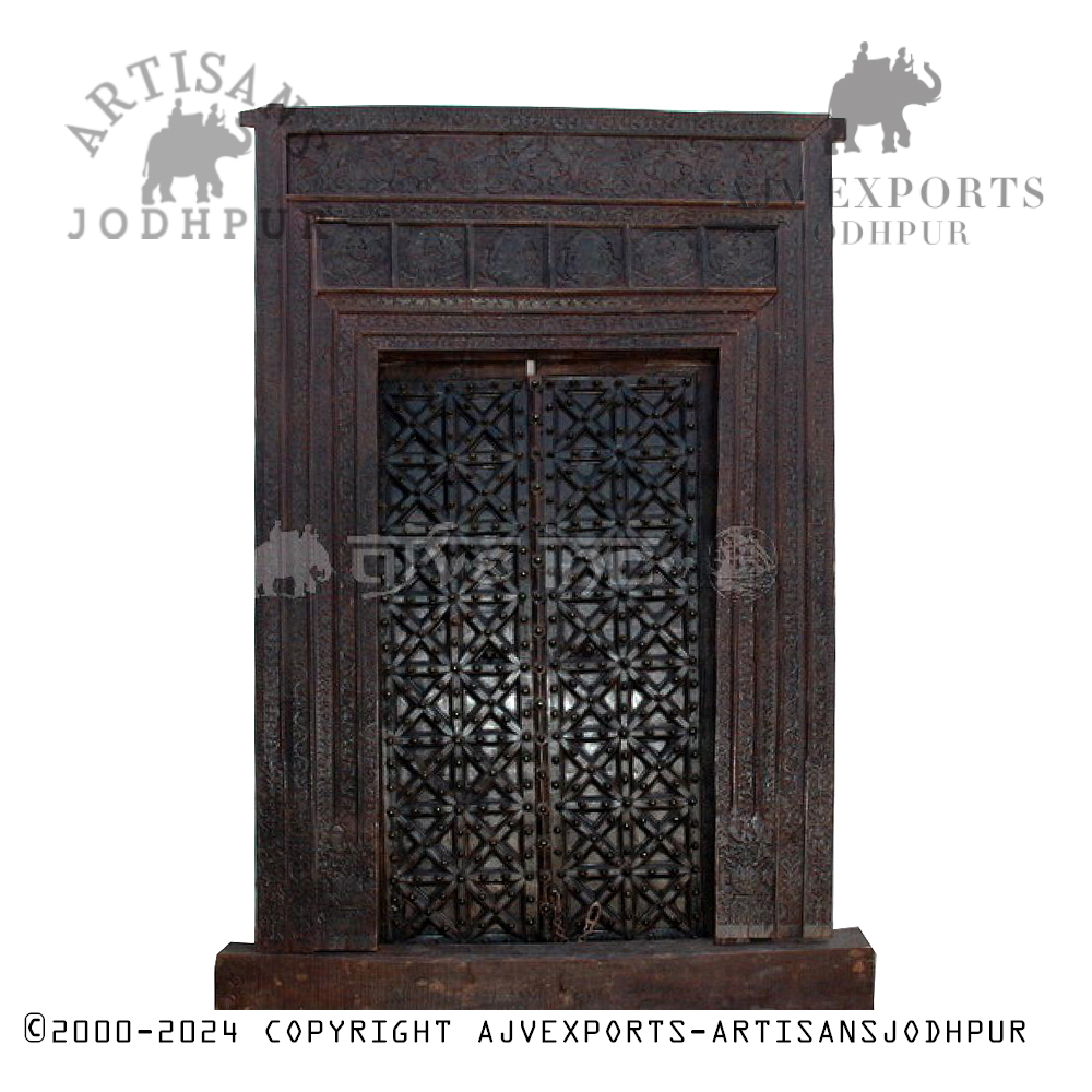 Elegant wooden door with intricate metal inlays and a finely carved frame, showcasing Jodhpur craftsmanship.