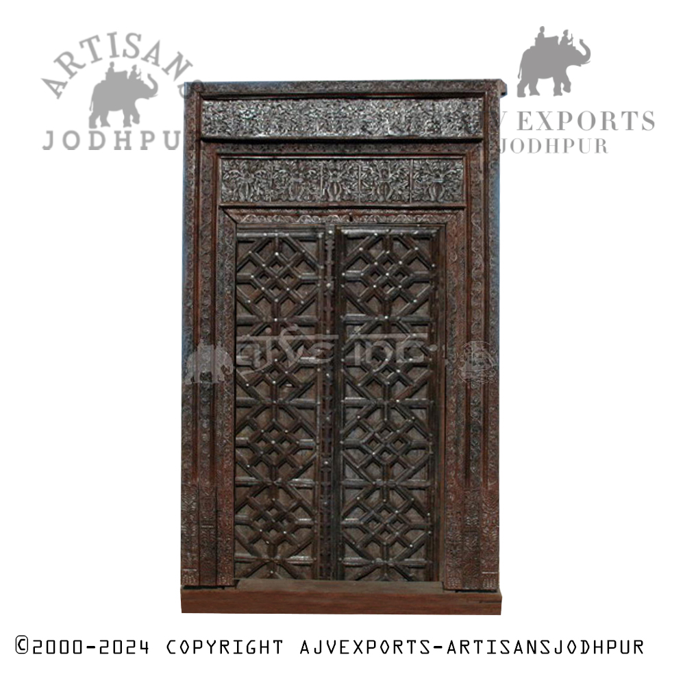 Traditional blue wooden door with metal accents from Artisans Jodhpur.