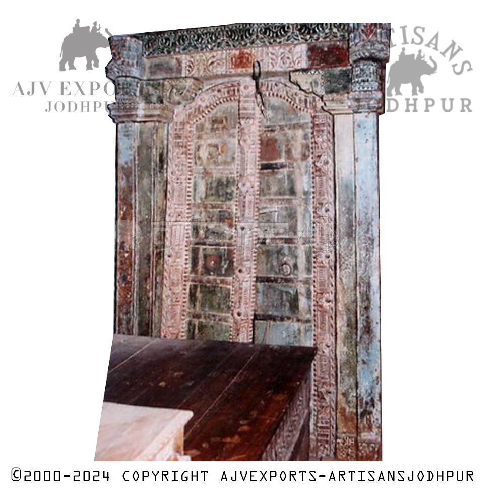 Weathered wooden door with intricate carvings and designs from Jodhpur, India
