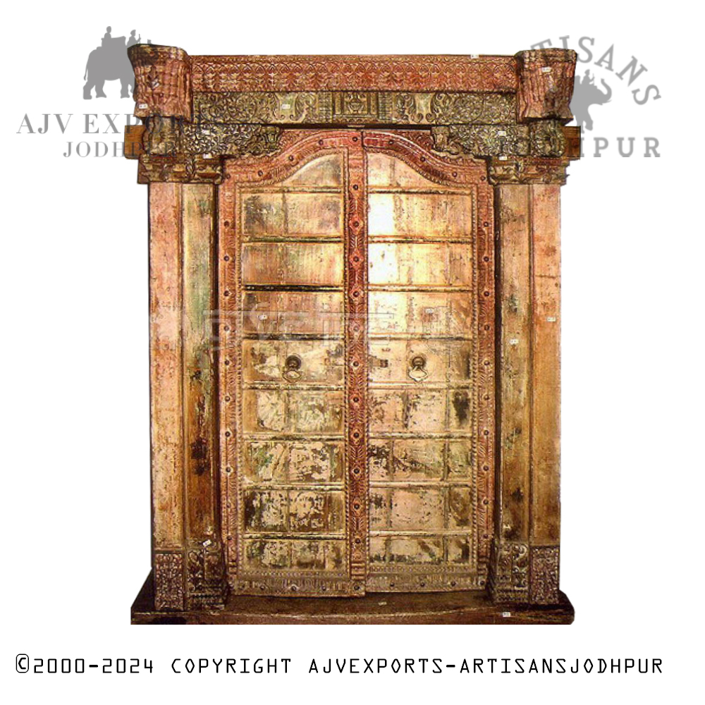 Vintage Indian door with brass details and a deep brown patina.