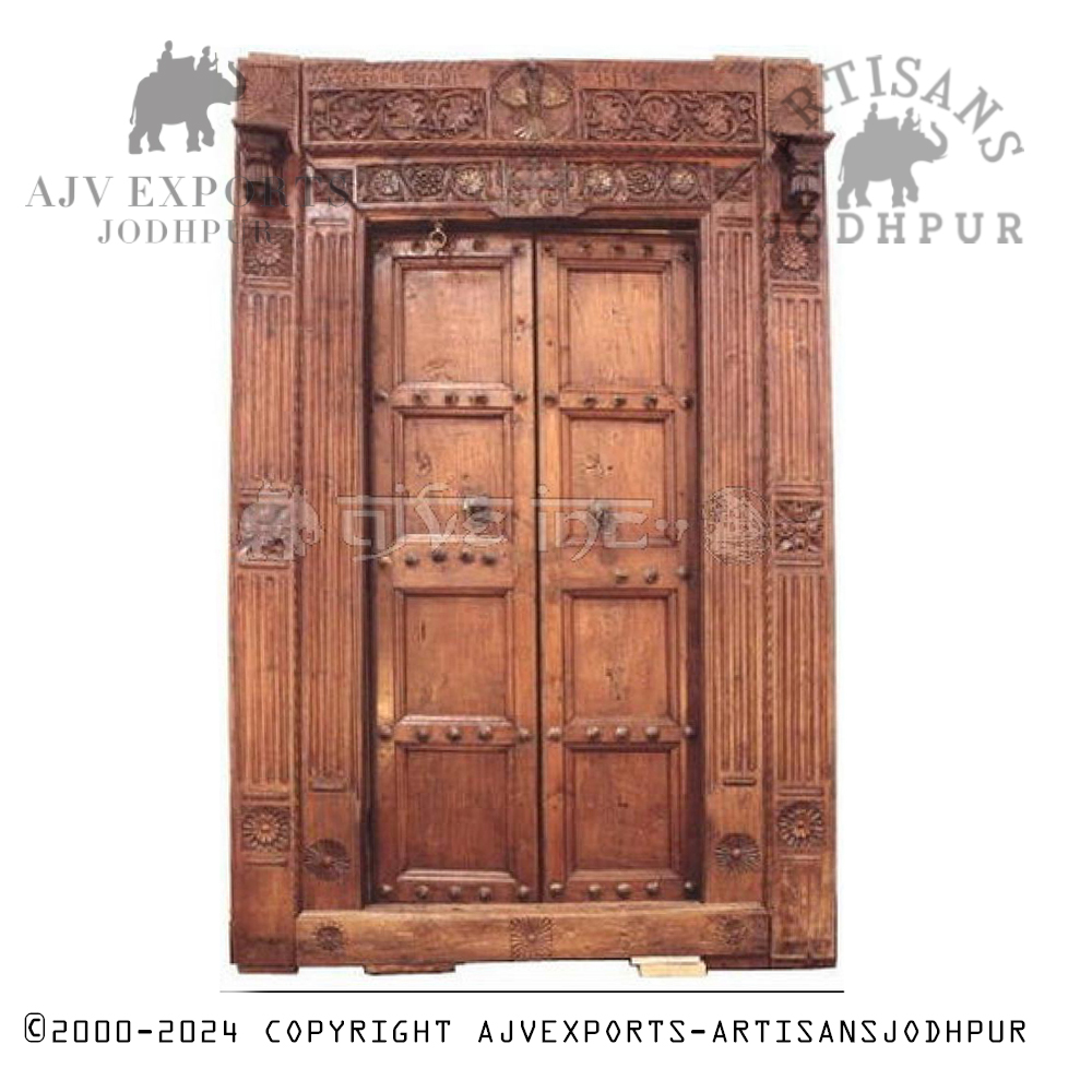 Majestic Indian palace door adorned with ornate features and a grand structure