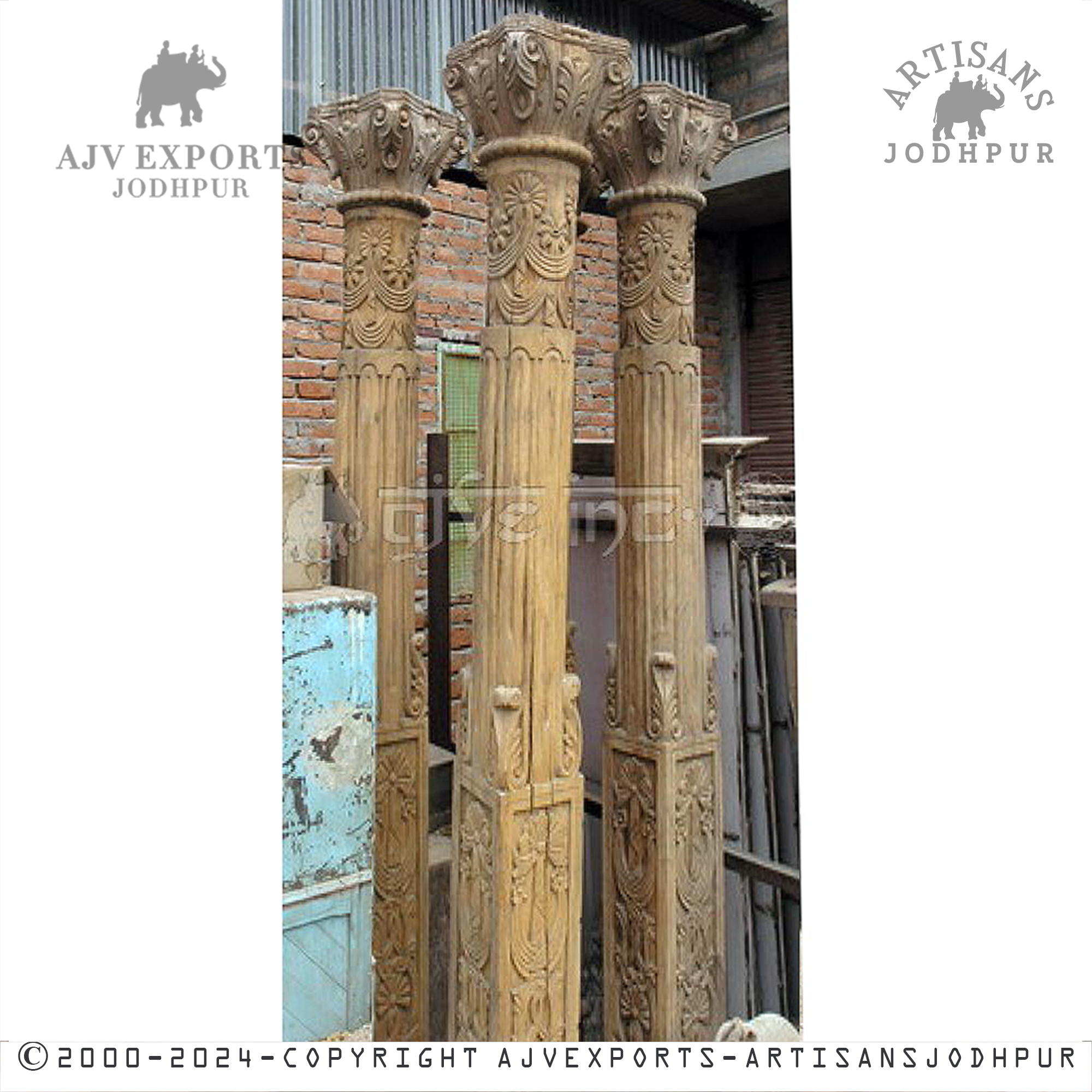 A wooden column with elaborate classical carvings and ancient architectural design.