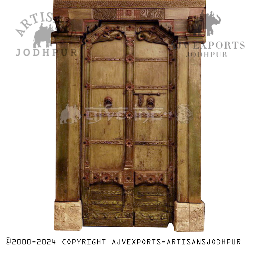 Rustic wooden door with metal knobs and a weathered finish, handcrafted by Artisans Jodhpur.